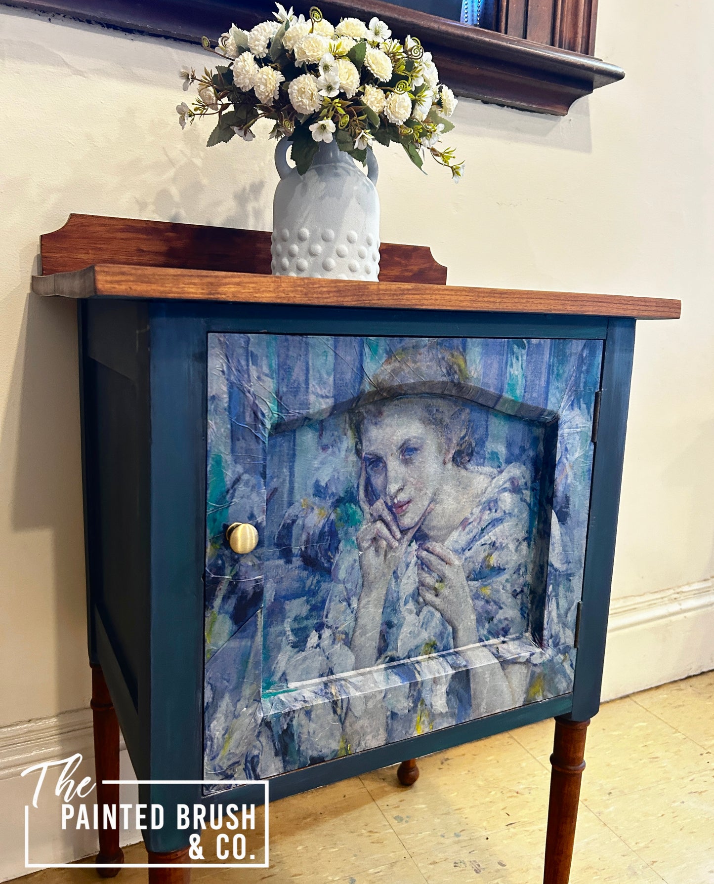 Woman in blue cabinet