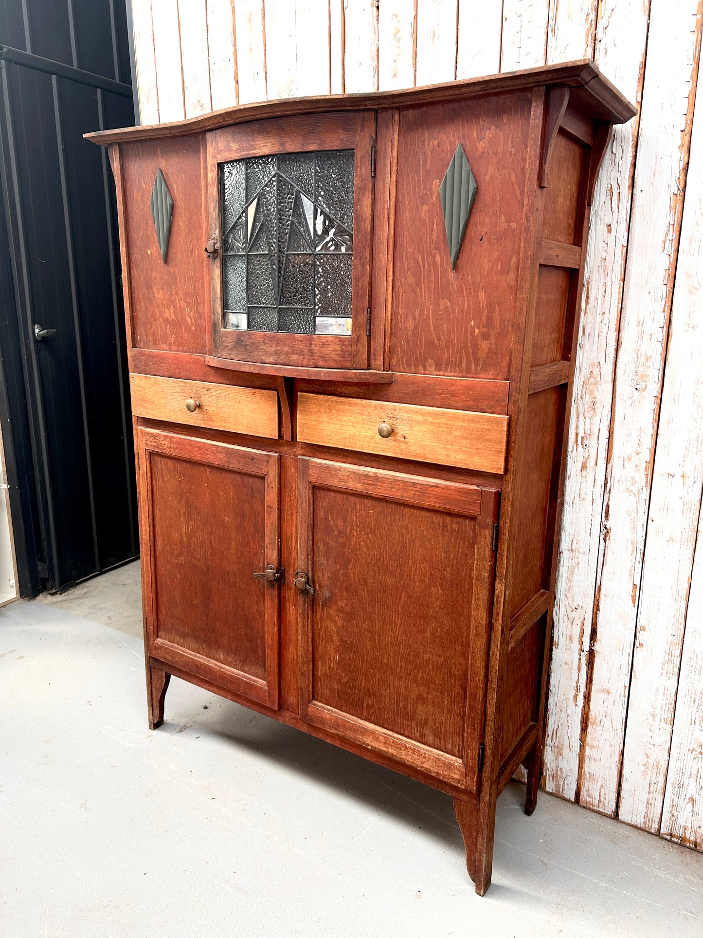 Vintage kitchen dresser with curved lead light glass