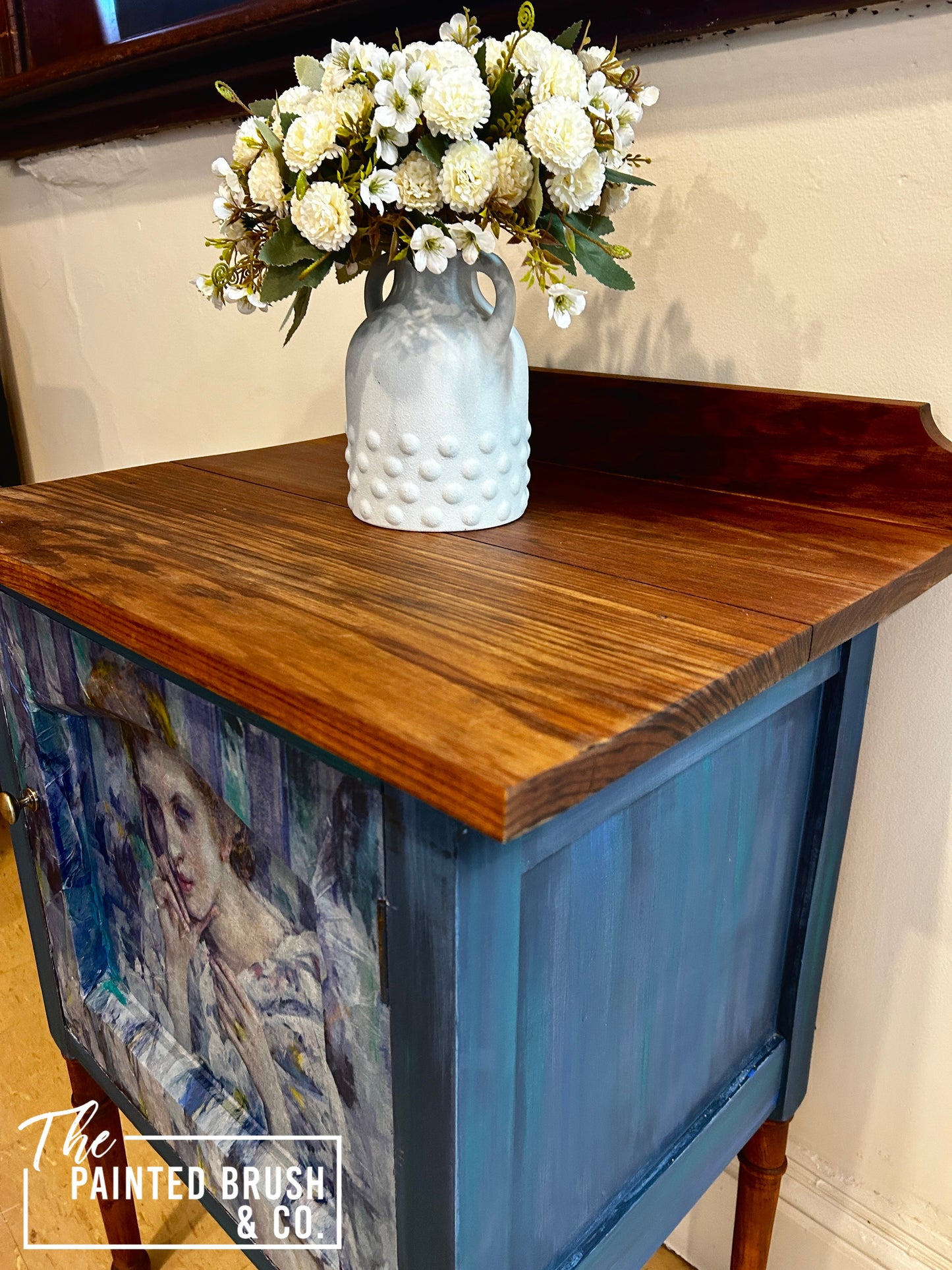 Woman in blue cabinet