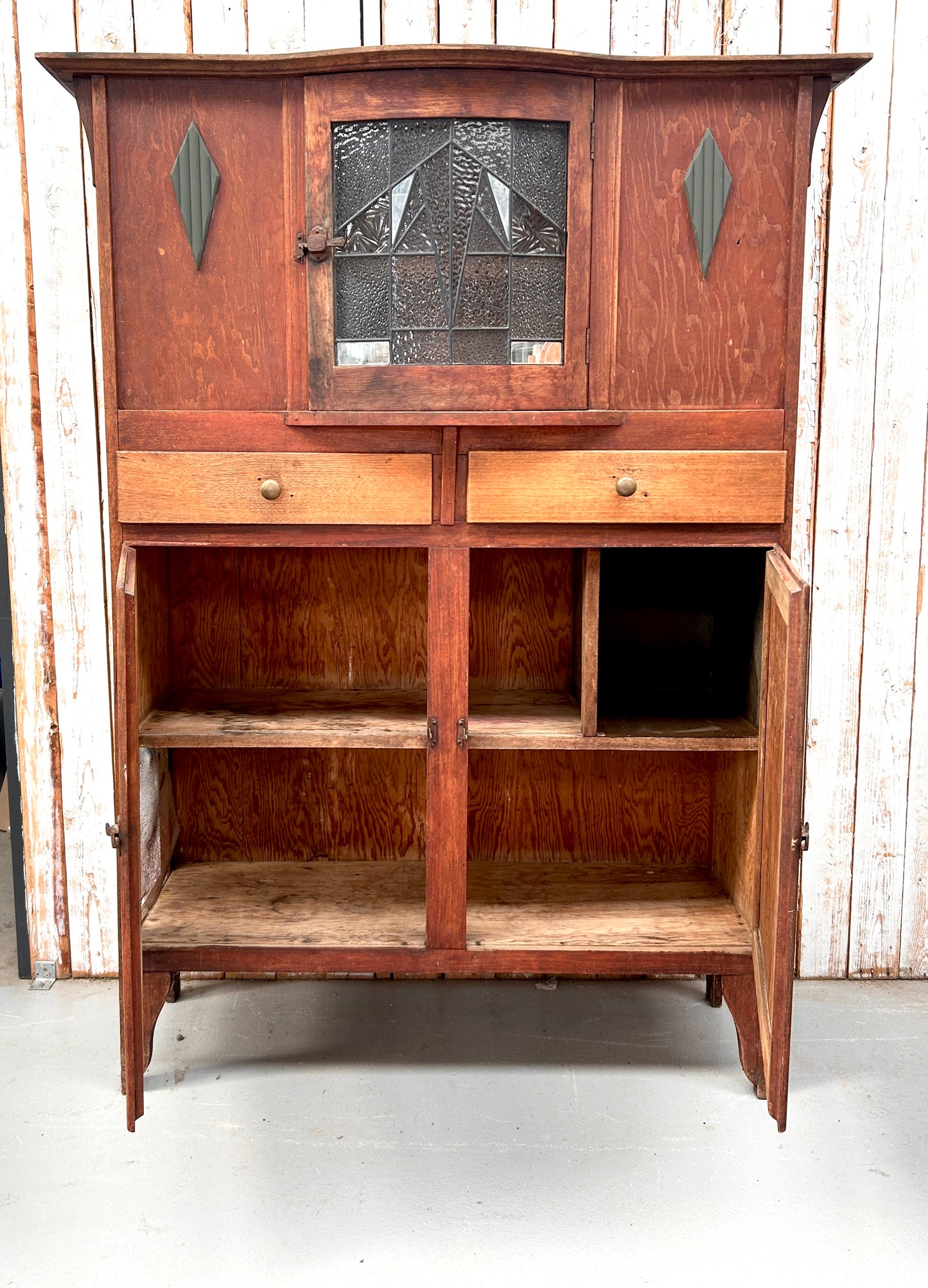 Vintage kitchen dresser with curved lead light glass