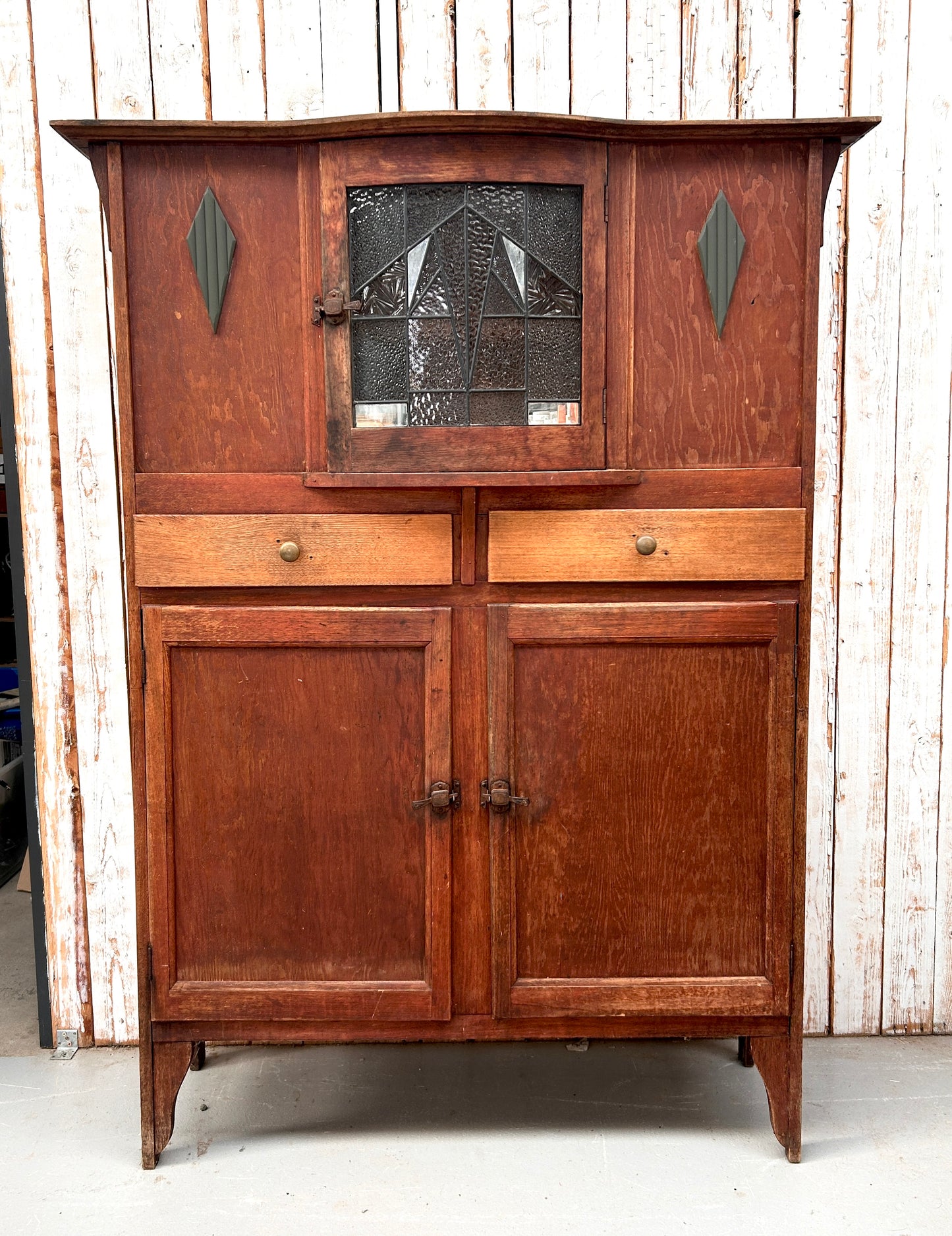 Vintage kitchen dresser with curved lead light glass