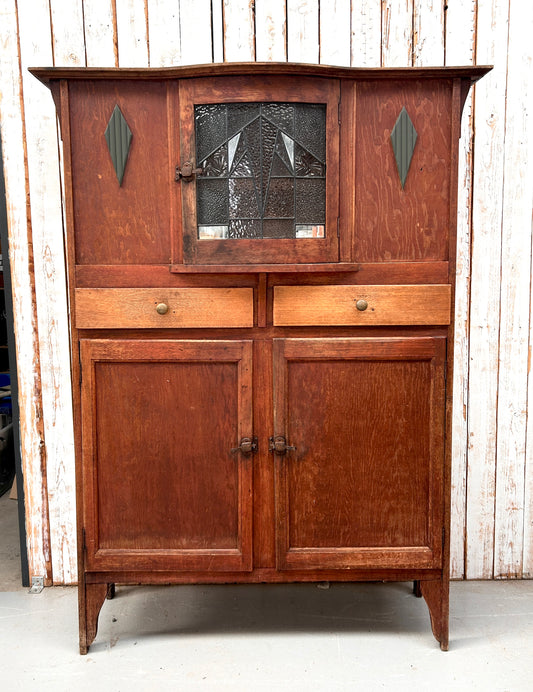 Vintage kitchen dresser with curved lead light glass