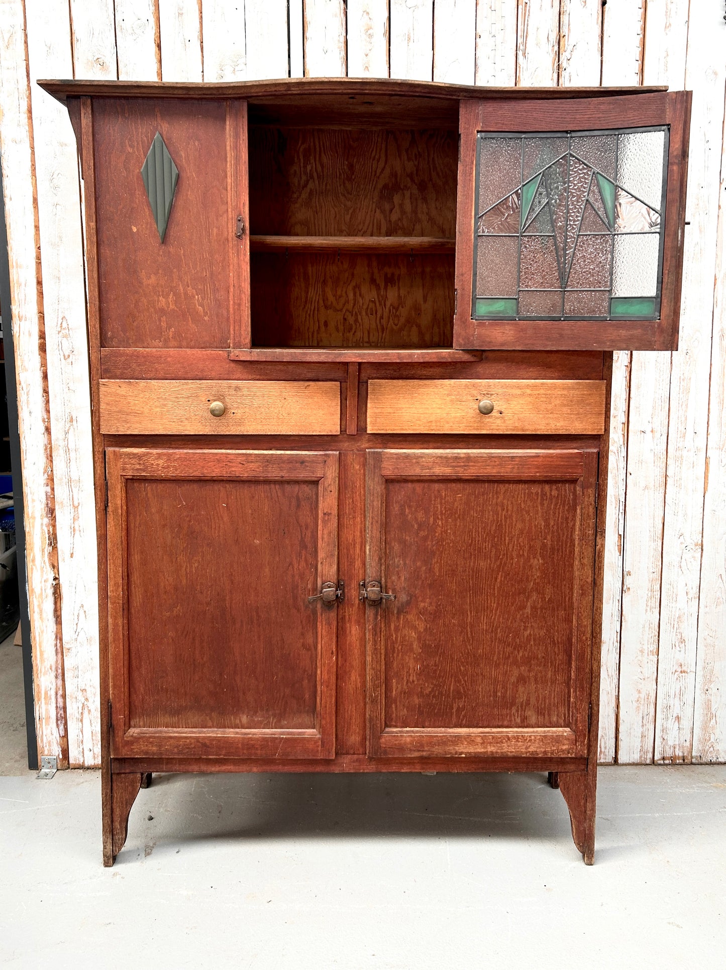 Vintage kitchen dresser with curved lead light glass