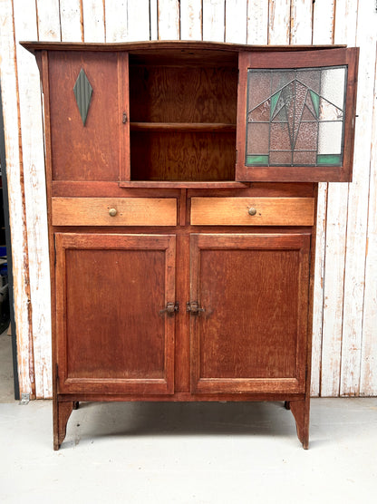 Vintage kitchen dresser with curved lead light glass